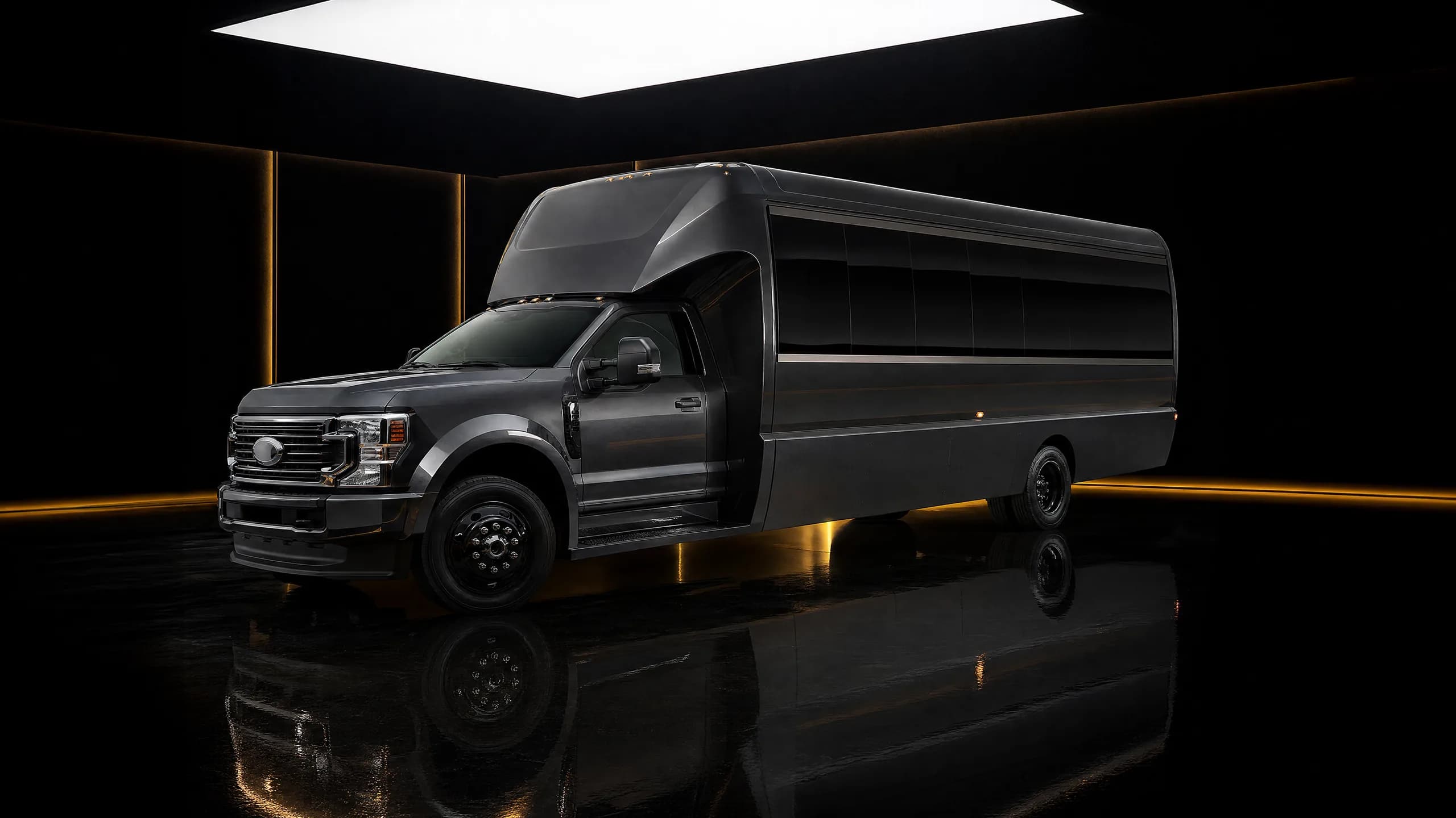 Seven Star Luxury Party Bus, a white 32-seat private touring coach in the showroom under a panel skylight — Vancouver group transport for weddings, galas, and celebrations